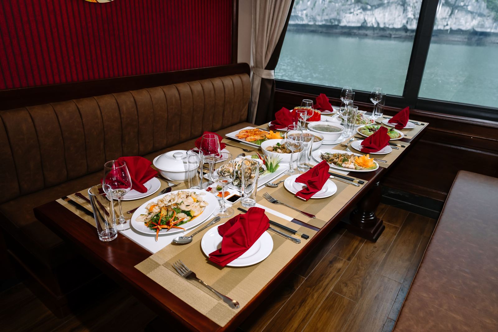 Seafood dinner table aboard the ship overlooking Lan Ha Bay